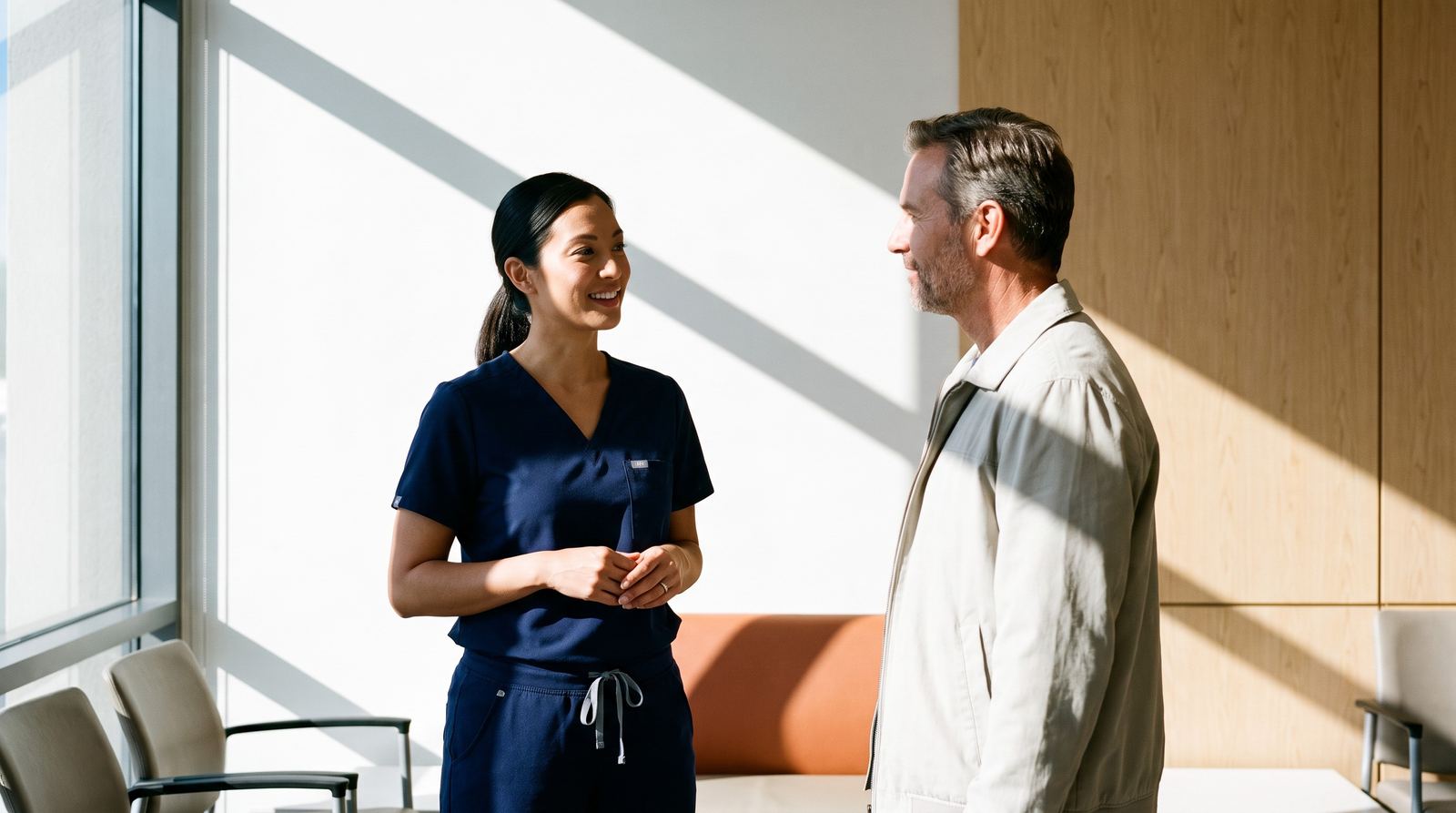 Technologist talking with a patient at an imaging center